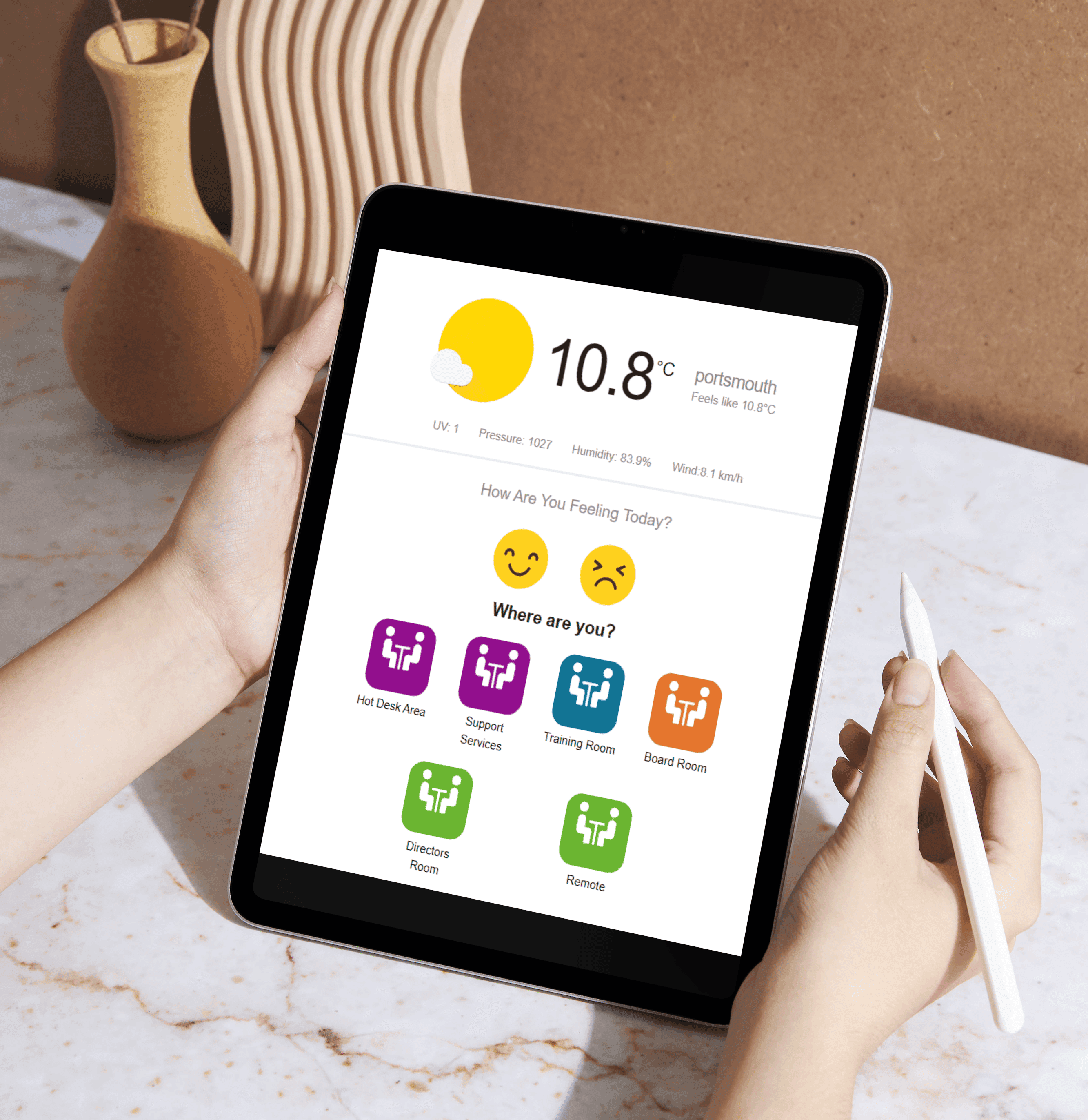 Person using Entelligently on a tablet to provide comfort feedback and location information.